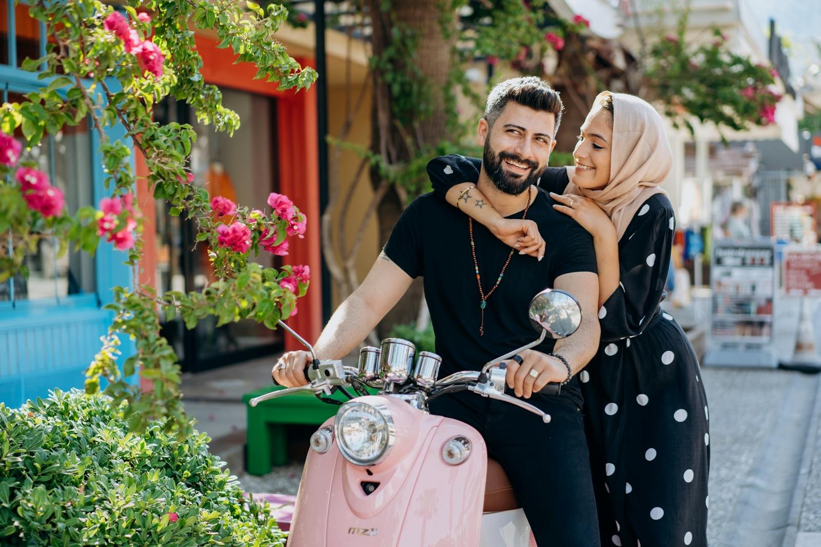 Couple Posing and Riding on a Motorcycle